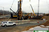 4/11/11: Shaft-drilling equipment sits on the island between the new south inner roadway to toll (SIT) and toll to north inner roadway (TNI) ramps at Interchange 7. This equipment will be used to drill shafts for the SIT & TNI ramp pier columns.
