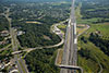 8/18/14: A view of the Interchange 7 area looking north showing the completed outer roadway lanes and the closed inner roadway under reconstruction. In the next series of photographs, Widening construction during Contract 203 will be profiled.