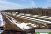 1/5/11: A progress photo of work on the future South to North Outer Roadway (SNO) near Perrineville Road/County Road 630. Barriers have been placed to protect traffic and the worksite, and earthwork has begun.