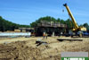 May 2011: The new piers for the new Windsor Road bridge are under construction. Forms for the piers and pier caps are placed and concrete is poured into the forms.