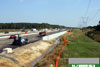 June 2011: At another location on the northbound outer roadway, an installed retention wall can be seen.