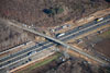 12/01/11: The contractor closed Perrineville Road at the bridge over the NJ Turnpike in March 2012. The contractor constructed a longer, higher bridge to span over the widened NJ Turnpike.