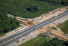 6/08/12: The deck and approaches of the old Perrineville Road bridge have been demolished, and the contractor is working on the new piers and abutments for the bridge.