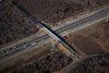 1/18/13: Bridge construction is complete, and Perrineville Road reopened to traffic in December 2012.