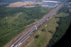 5/27/11: An aerial view of the NJ Turnpike with Hightstown-Cranbury Road crossing under it; the contractor has removed brush and trees (clearing & grubbing) in preparation for the new outer roadway construction.
