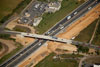 9/14/2012: An aerial view of Cranbury-Half Acre Road's new bridge near NJT milepost 71.25 built in Contract T869.120.802. Many bridges in the Widening Program had to be rebuilt or replaced to accommodate the new widened NJ Turnpike. The 803 contractor will build the new northbound outer roadway under this new structure.